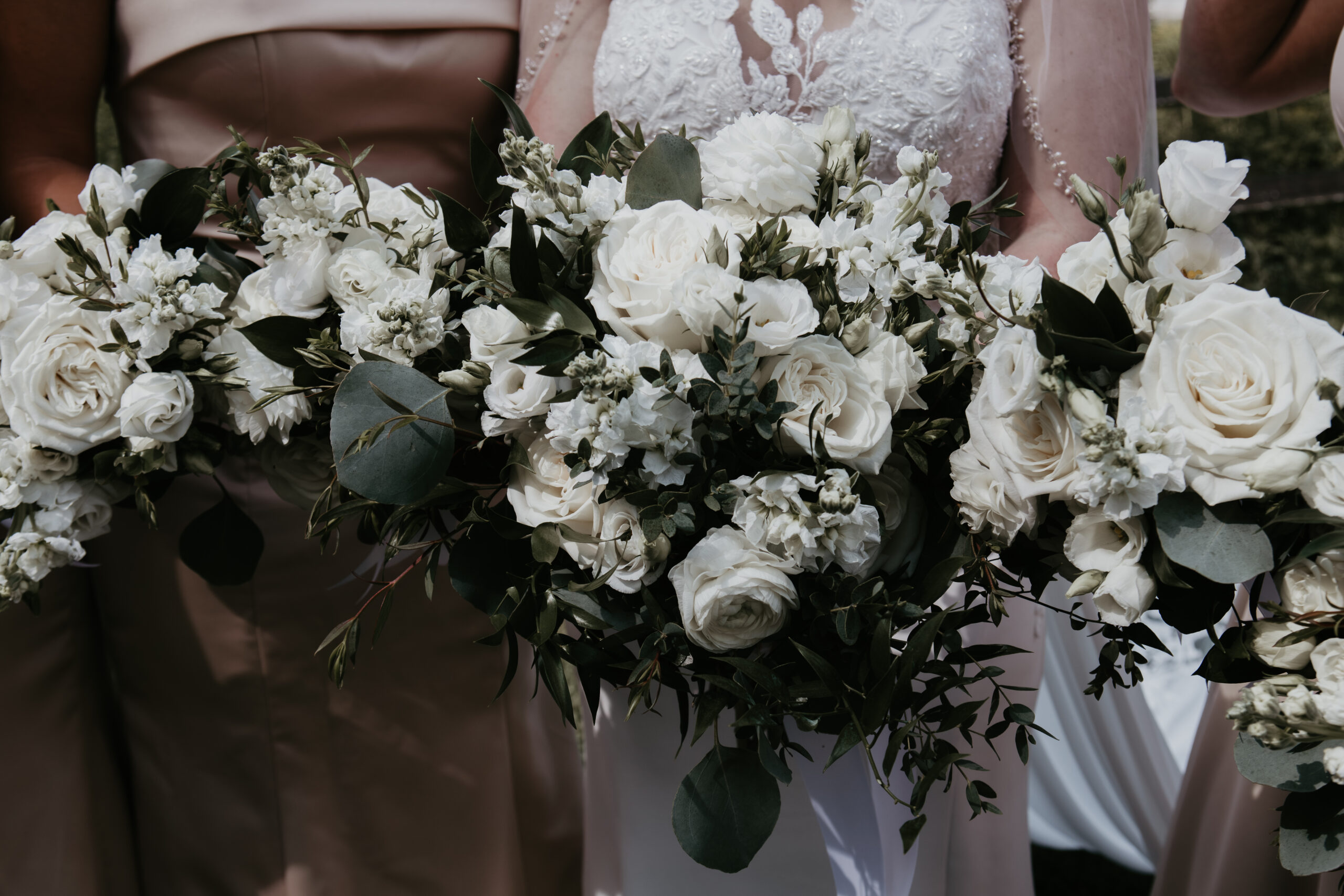 White rose bridal bouquets with greenery at Fenton Winery & Brewery wedding in Michigan
