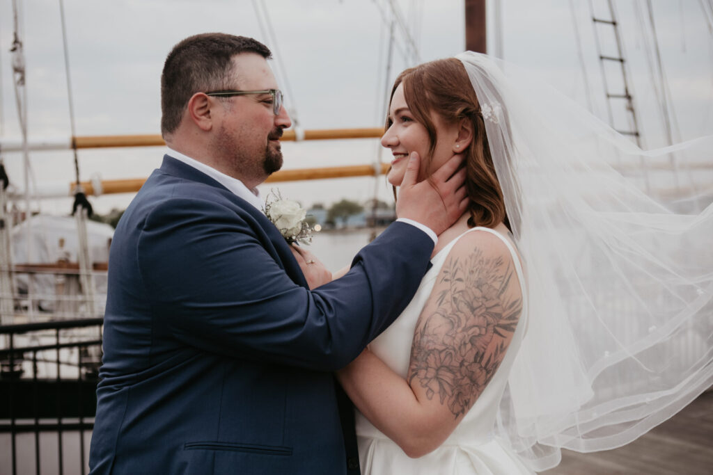 Bride and groom sharing a romantic moment at Bay City Michigan waterfront wedding